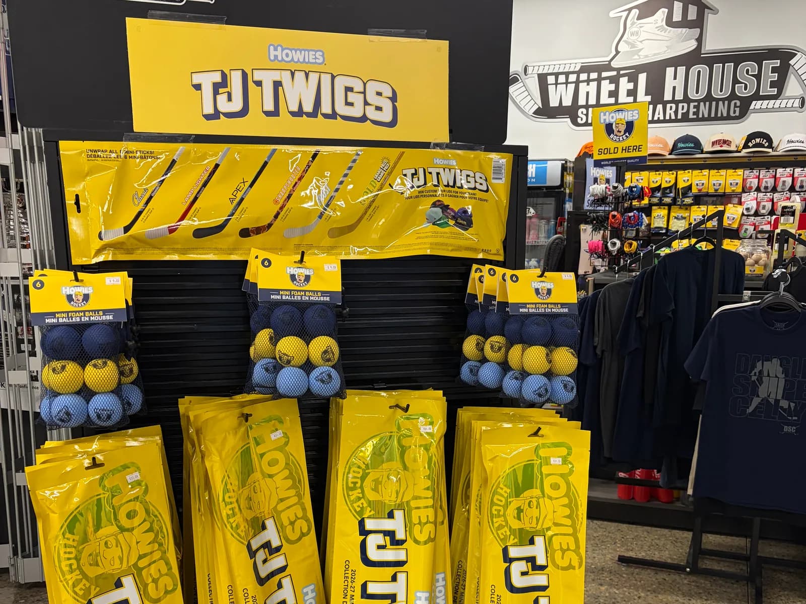 The Howies TJ Twigs 2026-27 mini stick display at Wheelhouse Skate Sharpening in Nisku, stocked with blind packs and mini foam balls